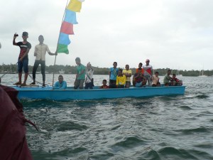 Local boats accompanying us ashore for welcome reception