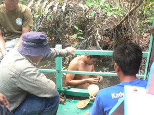 Over the side to fix the prop